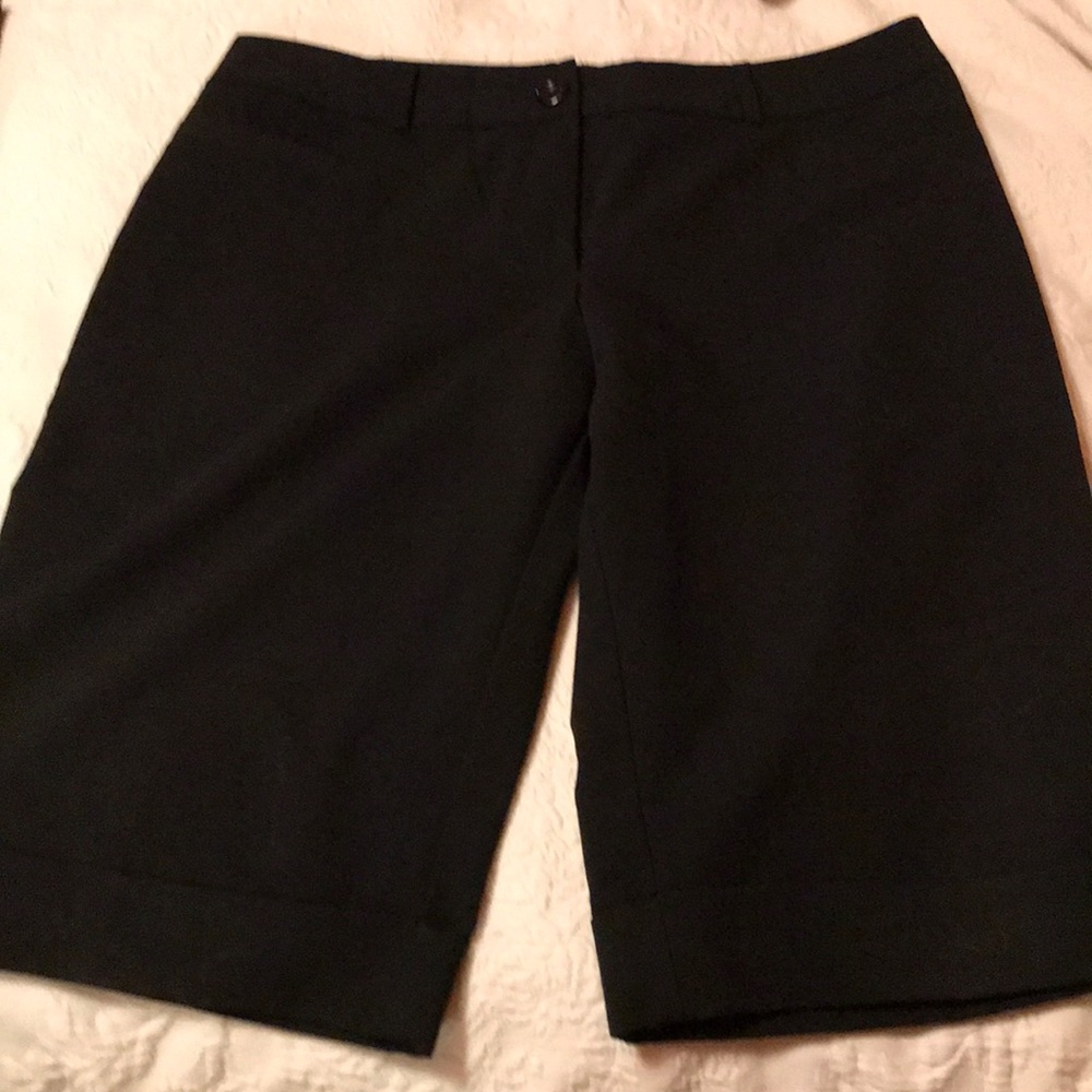 EUC.  Long black stretch shorts
